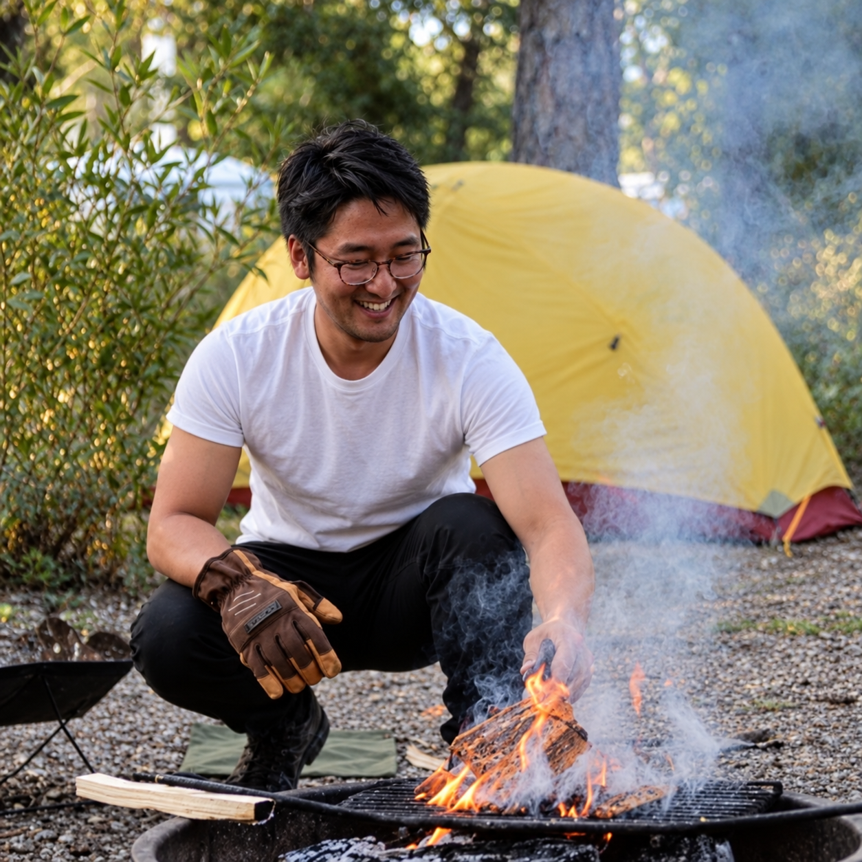 Campfire photo with short hair, plain white tee and bright smile