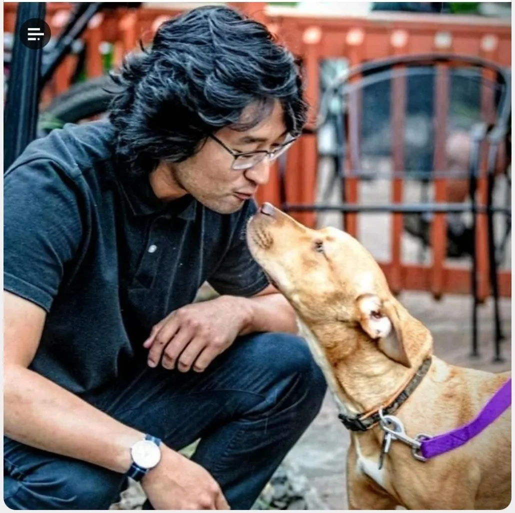 Unchanged original photo leaning affectionately toward his dog